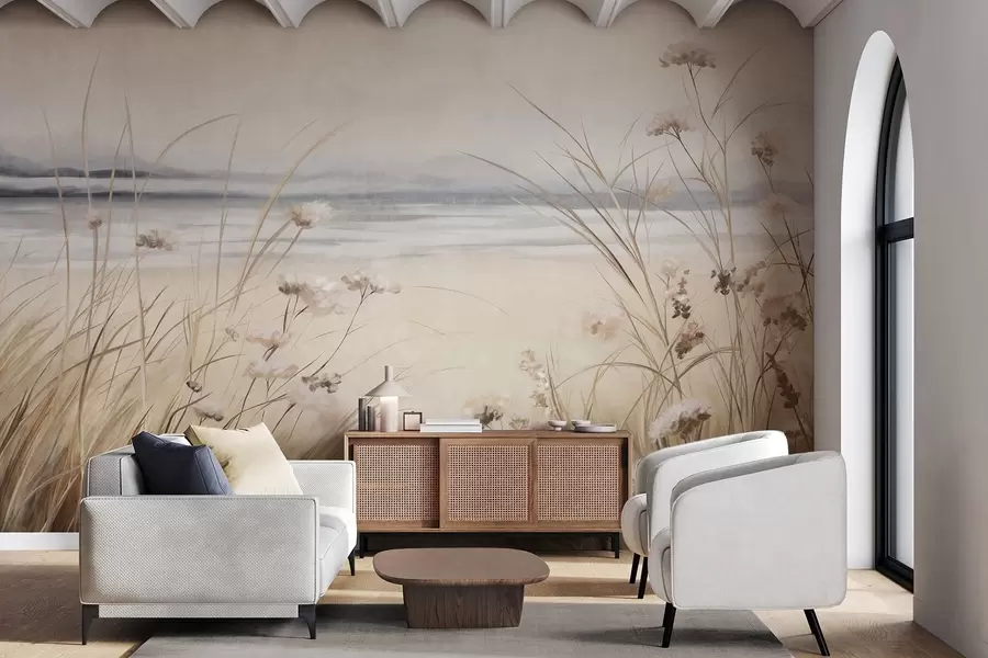 fototapet Un câmp de grâu cu flori albe în prim-plan, o plajă și oceanul în fundal, culori pastelate neutre w09298